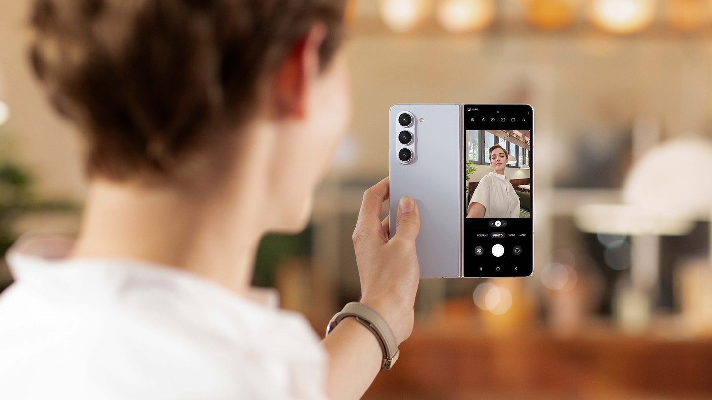 Person taking a selfie using a Samsung Galaxy Z Fold 5